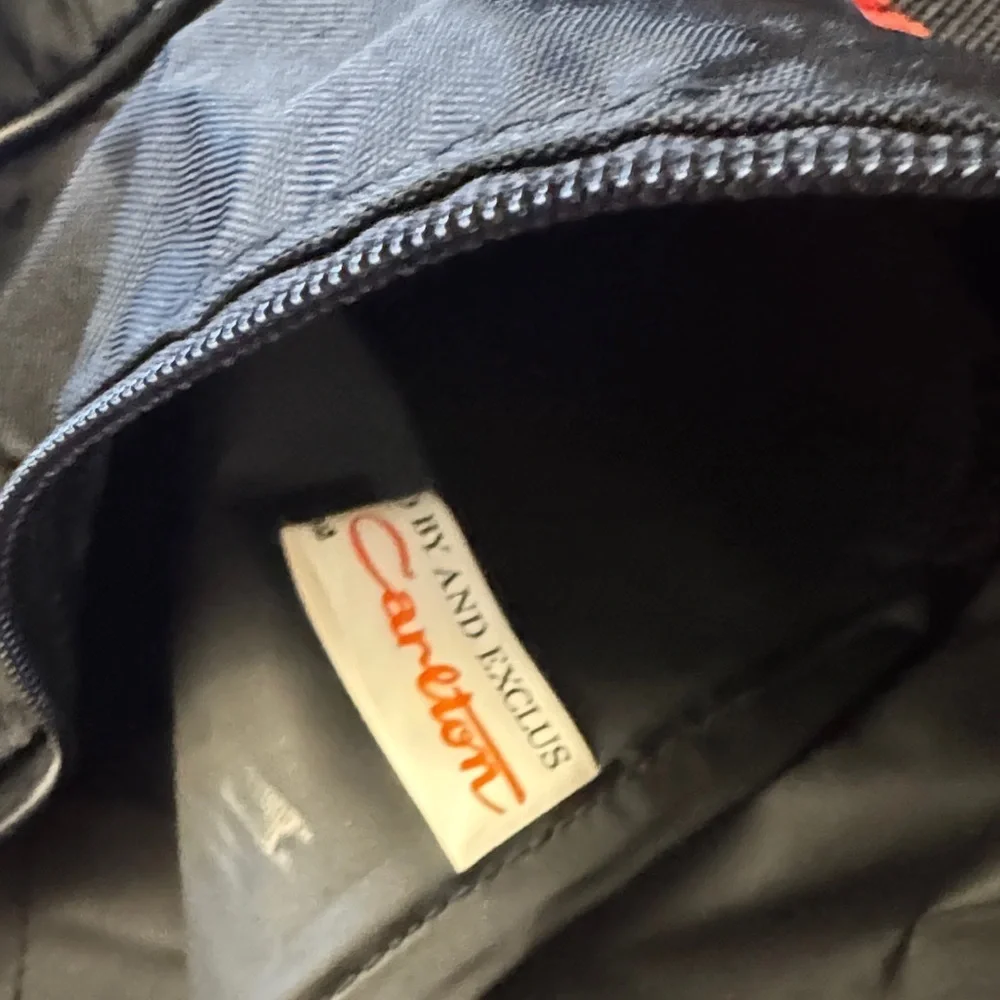 Carlton VTG Stylish Black Classic Nylon Duffel Bag with Red and Blue Accents